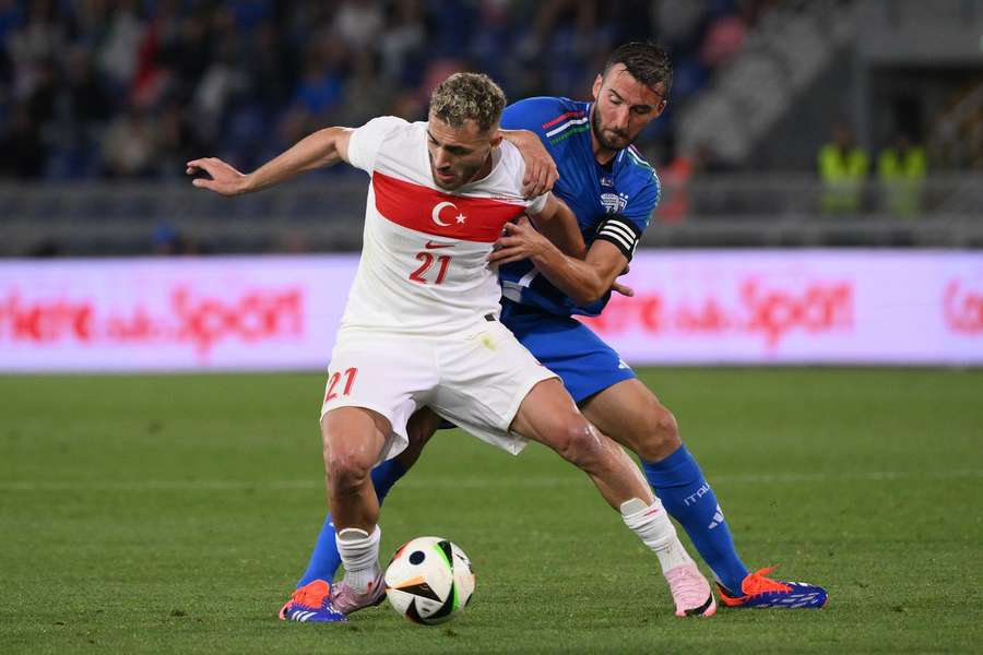 Baris Alper Yilmaz of Turkey and Bryan Cristante of Italy battle for the ball