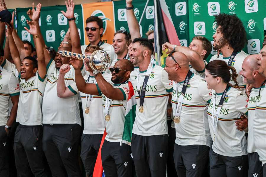 The Proteas pose with their new trophy