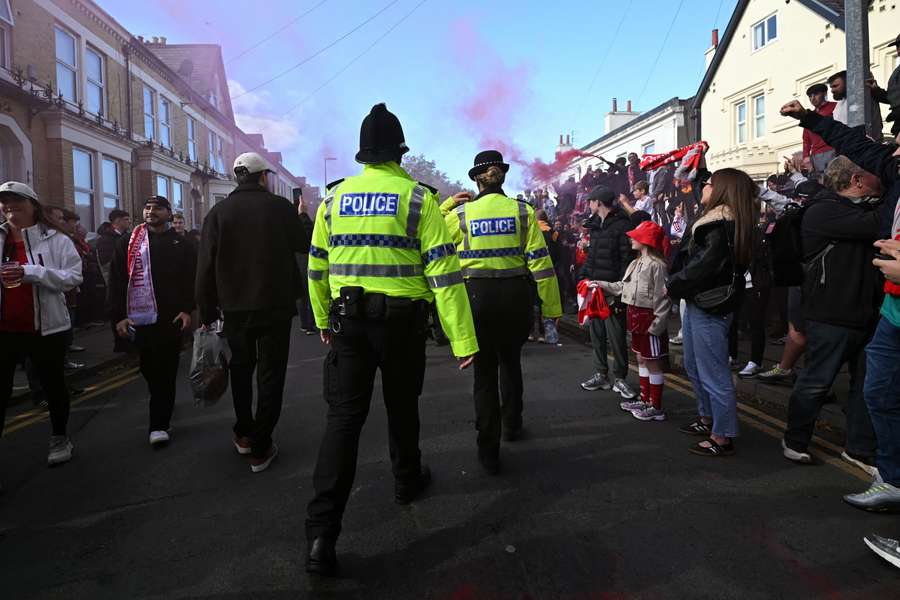 Police officers walk the streets ahead of Liverpool's game with Manchester City Police officers walk the streets ahead of Liverpool's game with Manchester City
