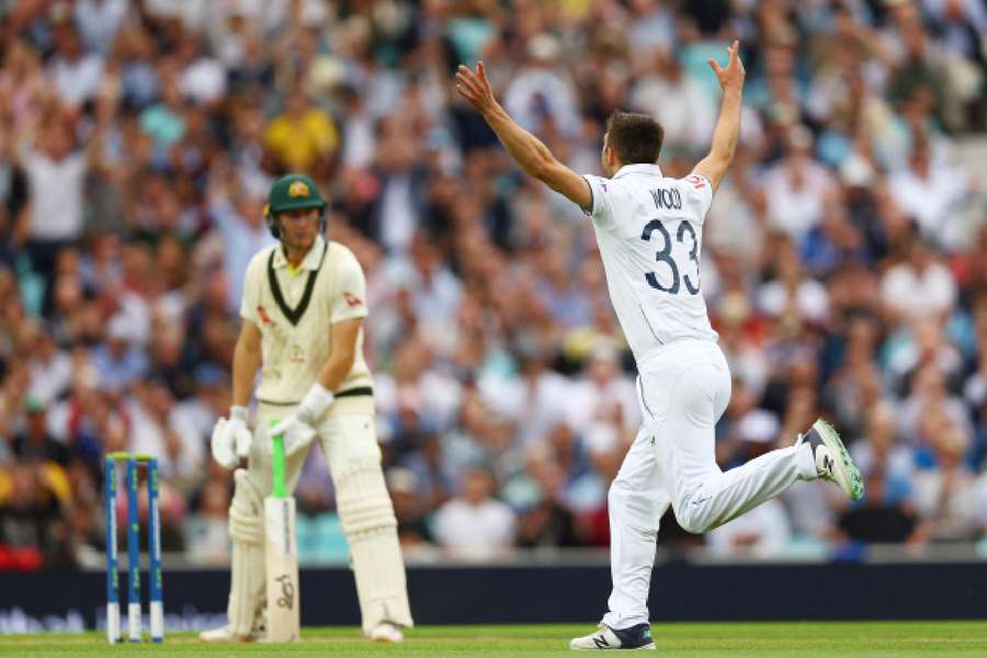 England's Mark Wood celebrates after taking the wicket of Australia's Marnus Labuschagne