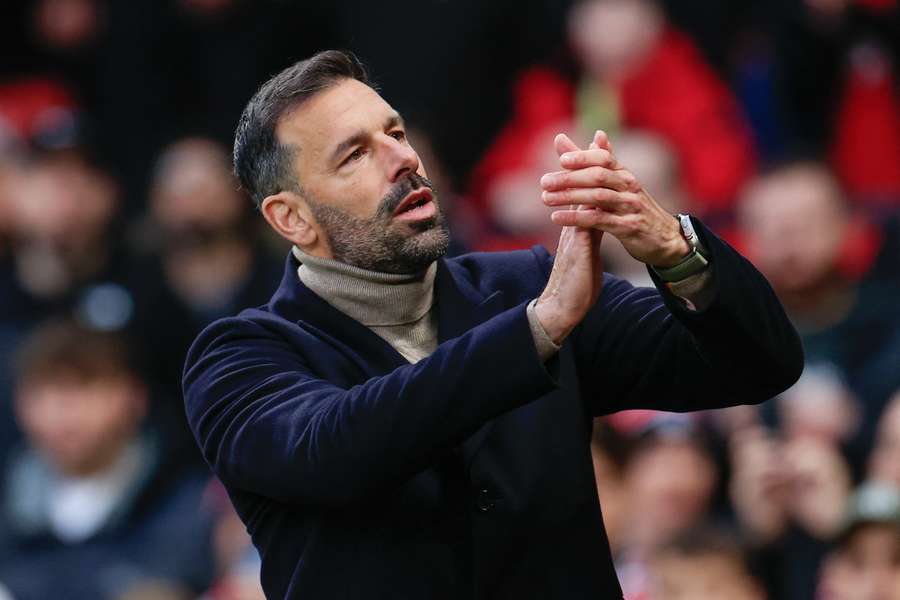 Ruud van Nistelrooy the interim Manchester United manager applauds fans