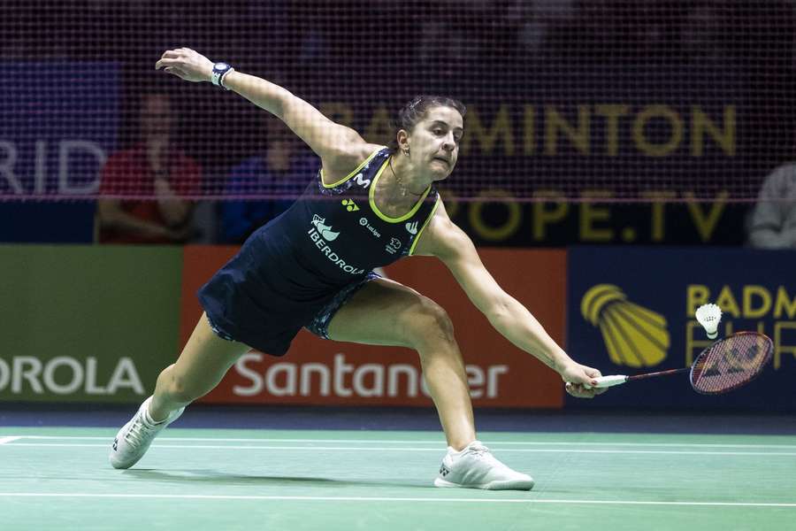 Carolina Martin of Spain in action against Czech player Katerina Tomalova during their women' singles match at the European Badminton Championships