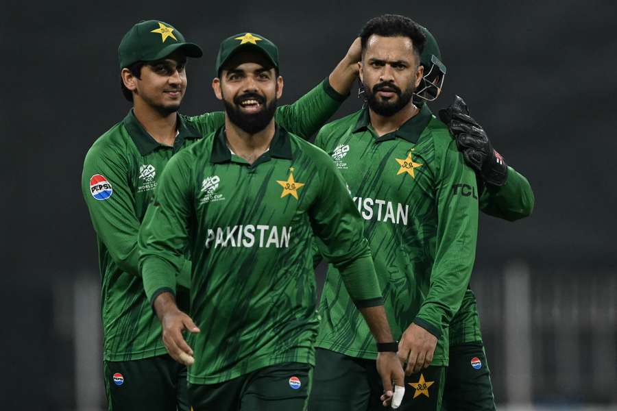 Pakistan's Mohammad Nawaz (right) celebrates with teammates after taking the wicket of USA's Andries Gous