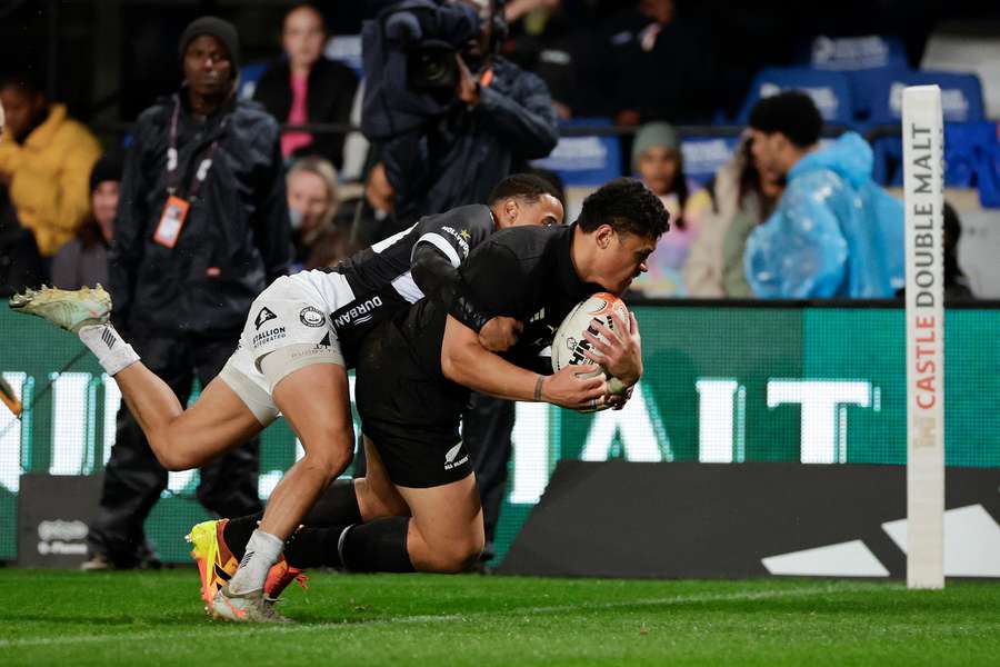 Caleb Clarke scoring a try in a tour match against the Sharks. Caleb Clarke scoring a try in a tour match against the Sharks.