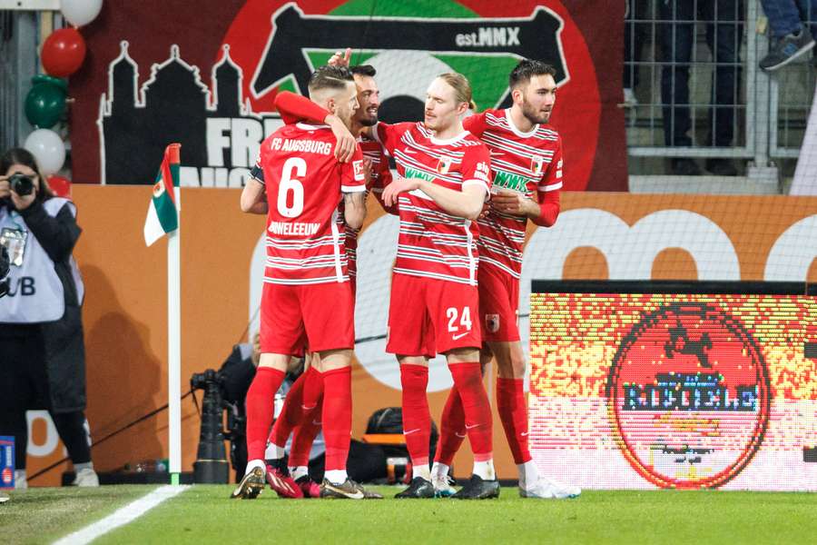 Augsburg celebrate their winner against Leverkusen