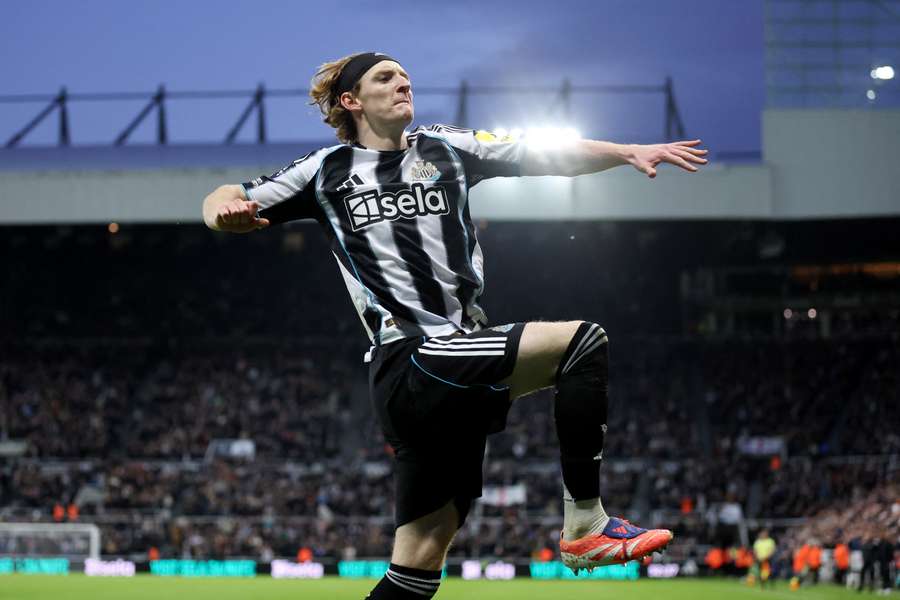Anthony Gordon celebrates after doubling Newcastle's lead from the penalty spot before half-time