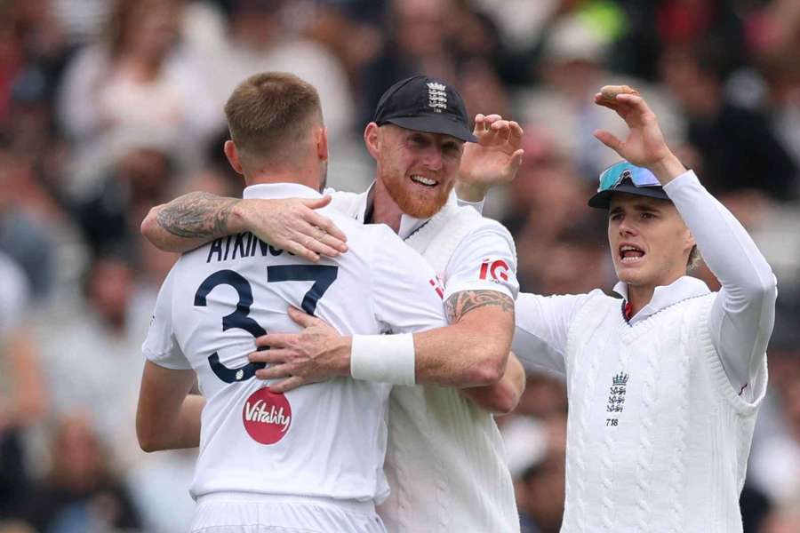 Stokes (C) and Atkinson (L) in action for England Stokes (C) and Atkinson (L) in action for England