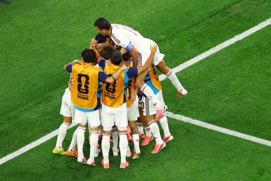 Spain celebrate their late winner Spain celebrate their late winner
