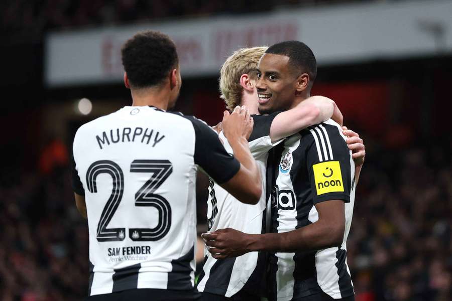 Isak celebrates with fellow goalscorer Gordon