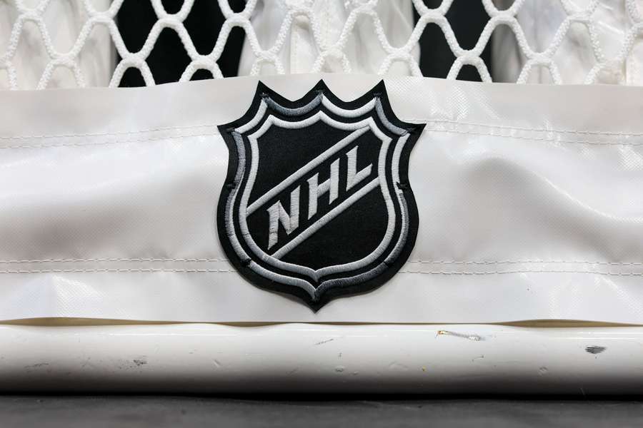 The NHL logo is seen on the netting of a goal