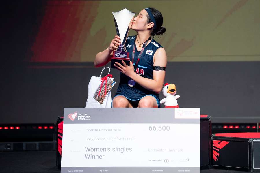 An Se Young of South Korea poses with her trophy after winning the women's singles final at Denmark Open