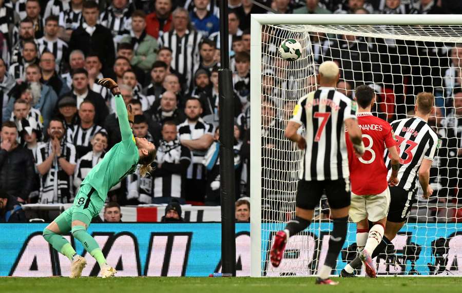 Newcastle United's German goalkeeper Loris Karius concedes a second goal after Rashford's effort deflects over him