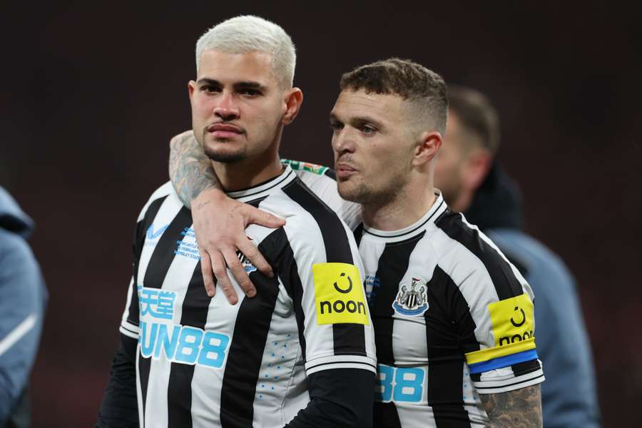 Newcastle United's Brazilian midfielder Bruno Guimaraes and Newcastle United's English defender Kieran Trippier react to their defeat 