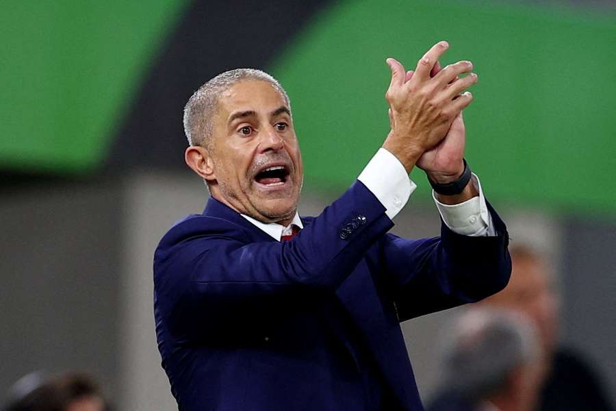 Albania coach Sylvinho on the touchline 