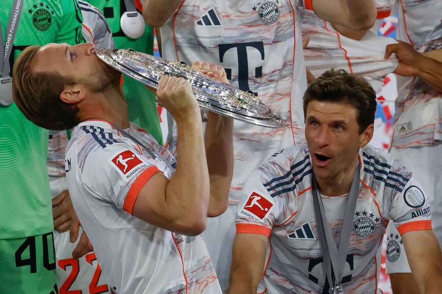 Harry Kane celebrates with the Bundesliga shield on Saturday