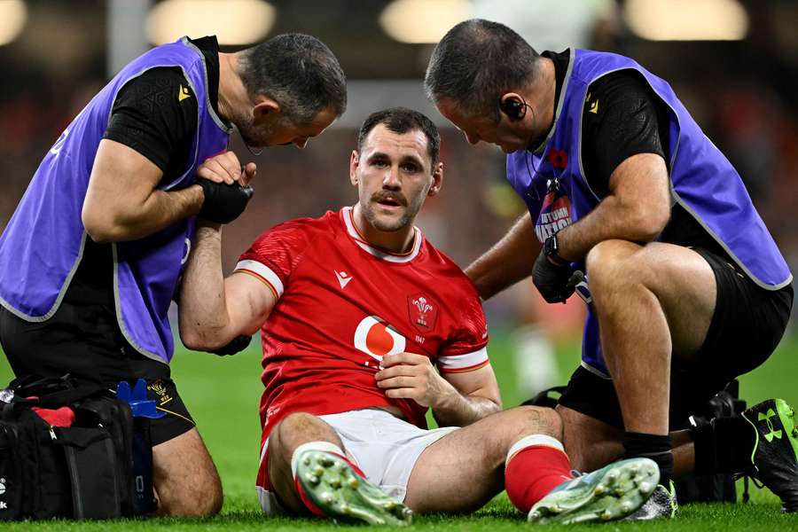 Wales scrum-half Tomos Williams receives treatment