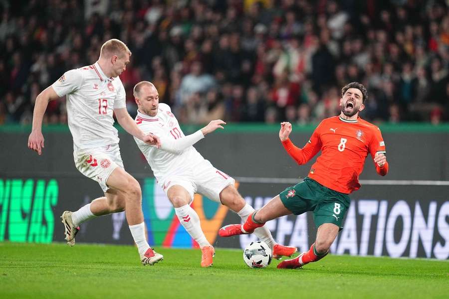 Christian Eriksen and Rasmus Nissen Kristensen in action against Portugal