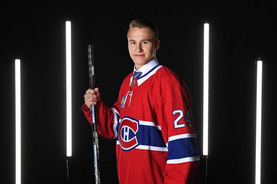 Ivan Demidov poses in a Montreal Canadiens jersey after being draft (2024)