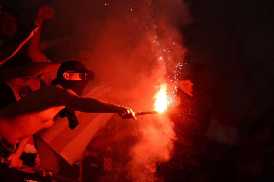 Croatia fan with a flare in the stands 