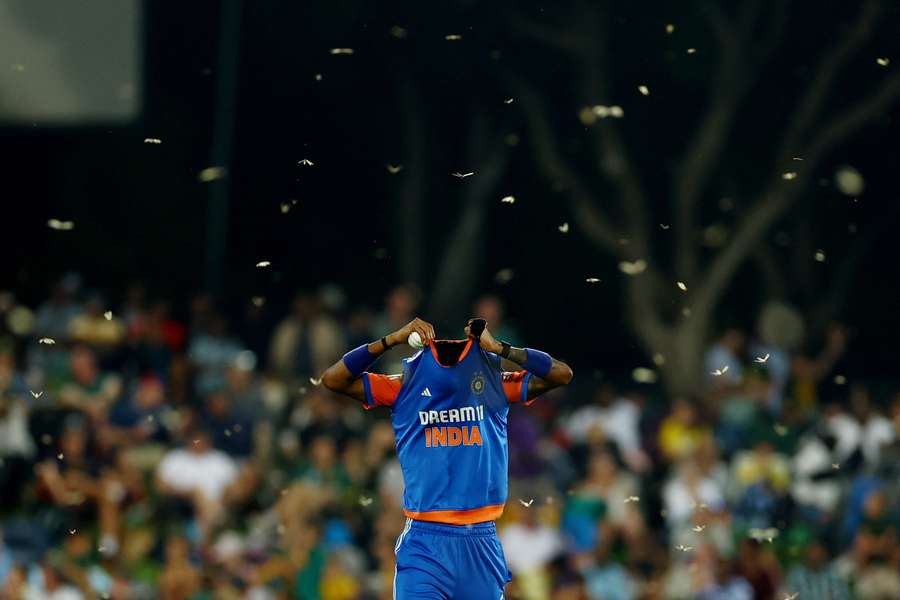 India's Hardik Pandya is surrounded by flying ants leading to play being stopped