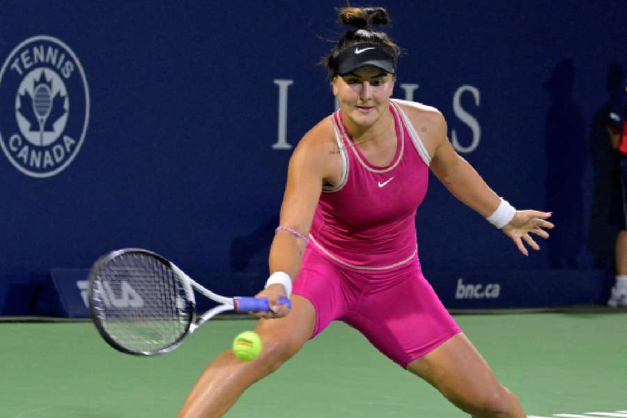 Bianca Andreescu (CAN) hits a forehand against Camila Giorgi (ITA) (not pictured) during first round play at IGA Stadium