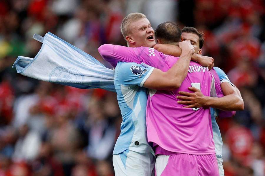 Man City's players celebrate their win over Man Utd Man City's players celebrate their win over Man Utd