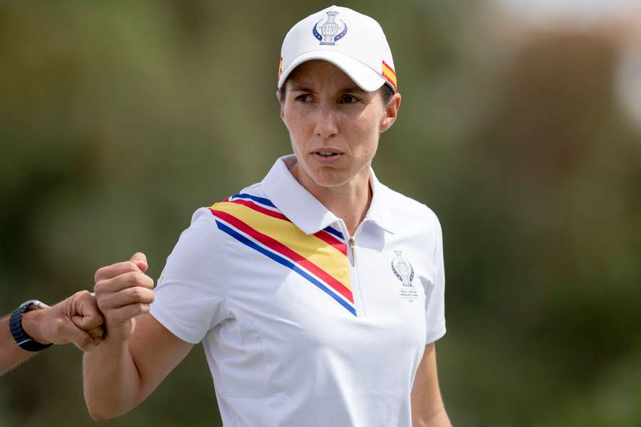 Team Europe's Spanish golfer Carlota Ciganda reacts with Emily Pedersen