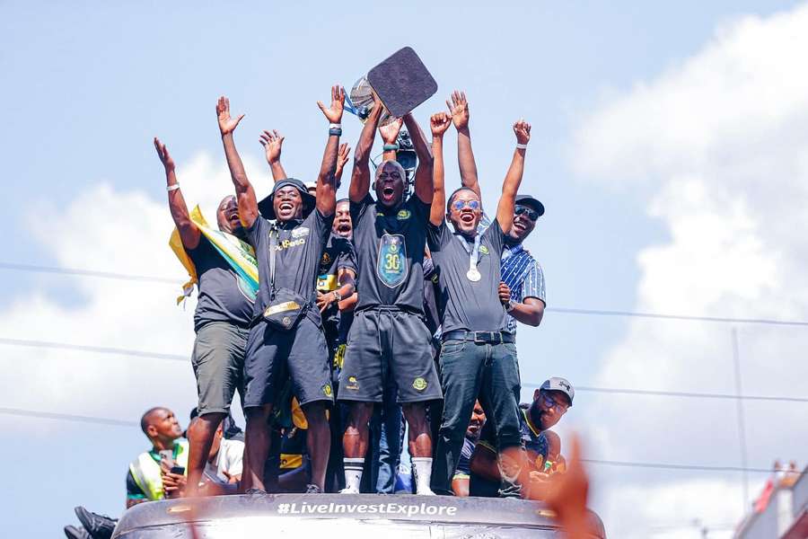 Yanga players with the trophy in the title-winning parade