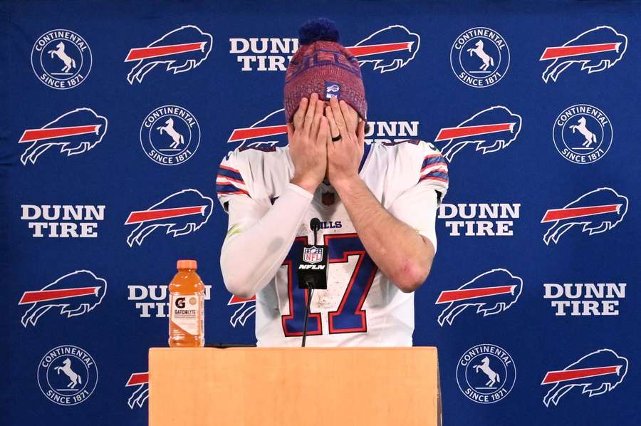 Buffalo Bills' Josh Allen covers his face during a press conference