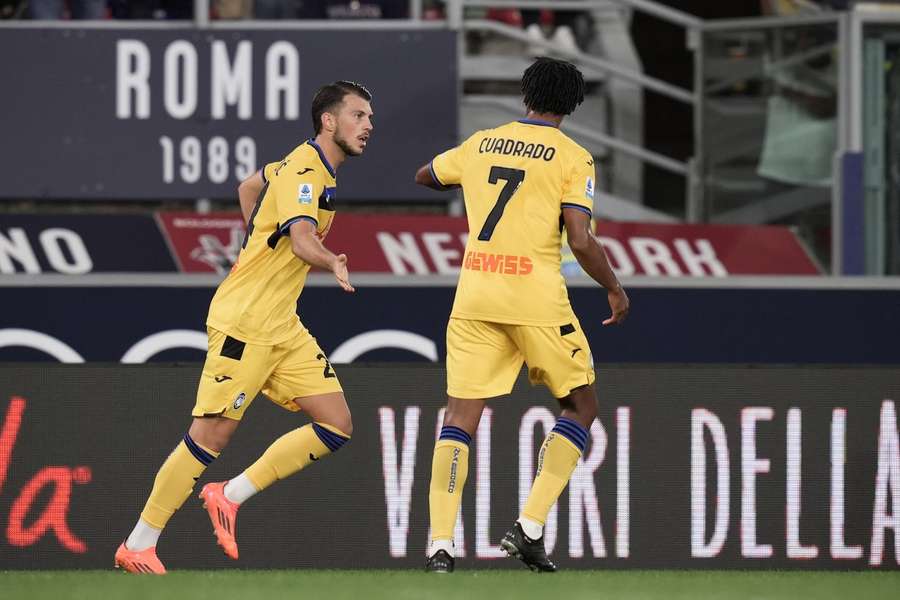 Samardzic celebrates with Cuadrado after scoring