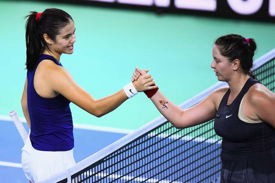 Great Britain's Emma Raducanu shakes hands with Slovakia's Viktoria Hruncakova