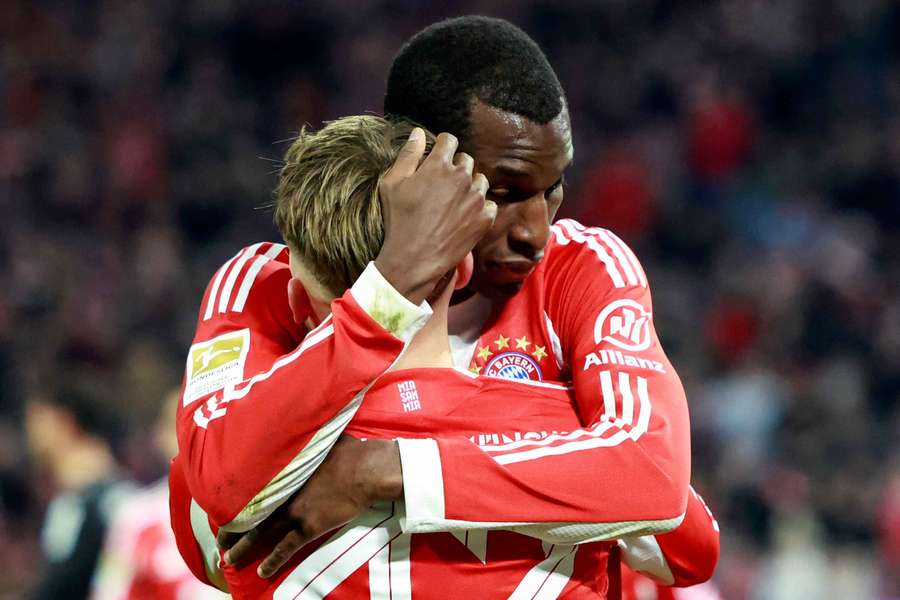 Bayern Munich's Nicolas Jackson celebrates scoring their fourth goal with Lennart Karl