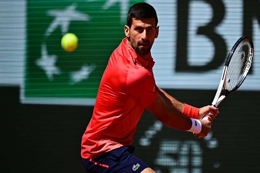 Serbia's Novak Djokovic plays a backhand return