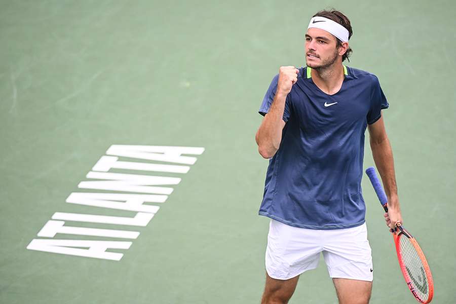 Taylor Fritz celebrates against Kei Nishikori