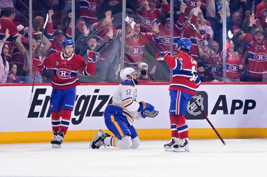 Canadiens' Lane Hutson (left) and Cole Caufield (right) celebrate goal during Game 3 against Buffalo Sabres