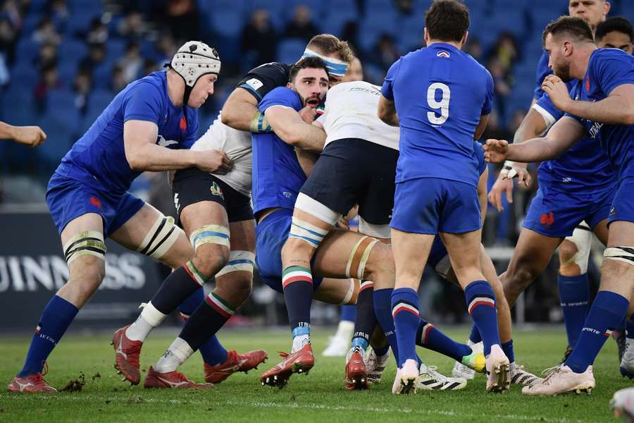 France's flanker Charles Ollivon is tackled during the Six Nations international rugby union match between Italy and France