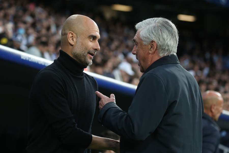 Manchester City's Pep Guardiola (L) with Real Madrid's Carlo Ancelotti (R)