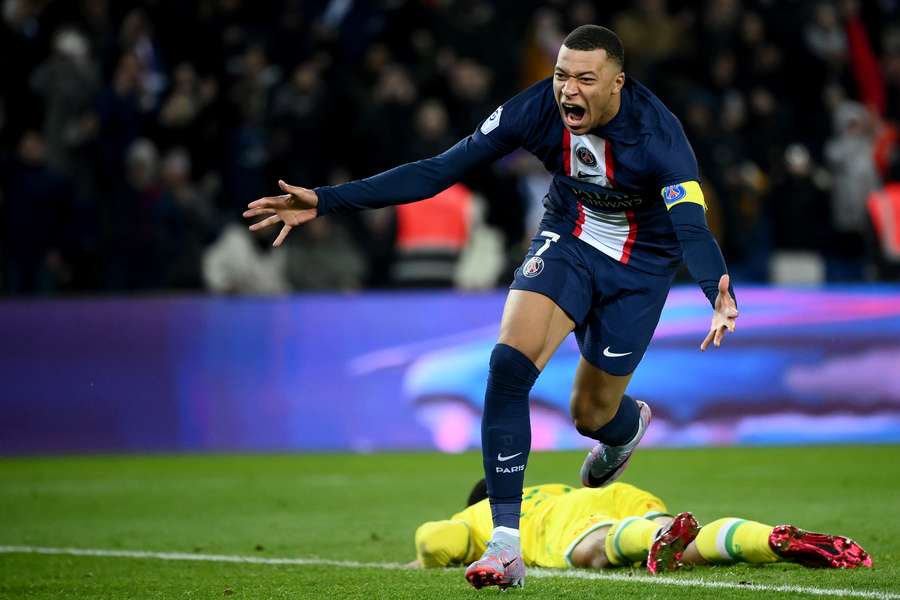 Paris Saint-Germain's French forward Kylian Mbappe celebrates after scoring against Nantes