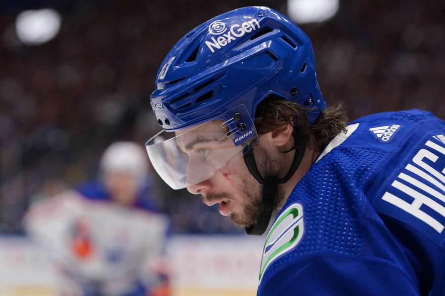 Vancouver Canucks defenceman Quinn Hughes focusing during a face-off against the Edmonton Oilers (2024)