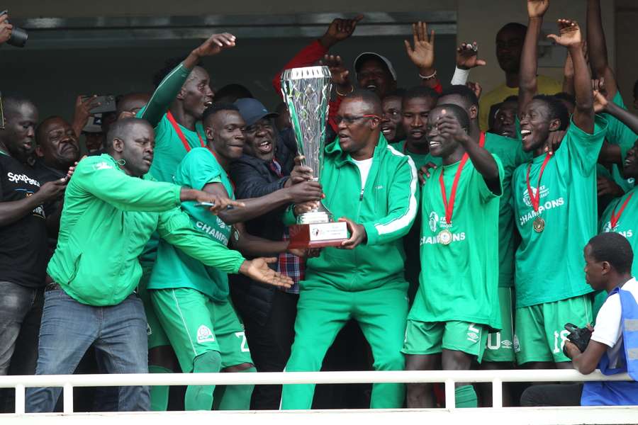 Gor Mahia players celebrate with the FKF league trophy in the 2022 season.