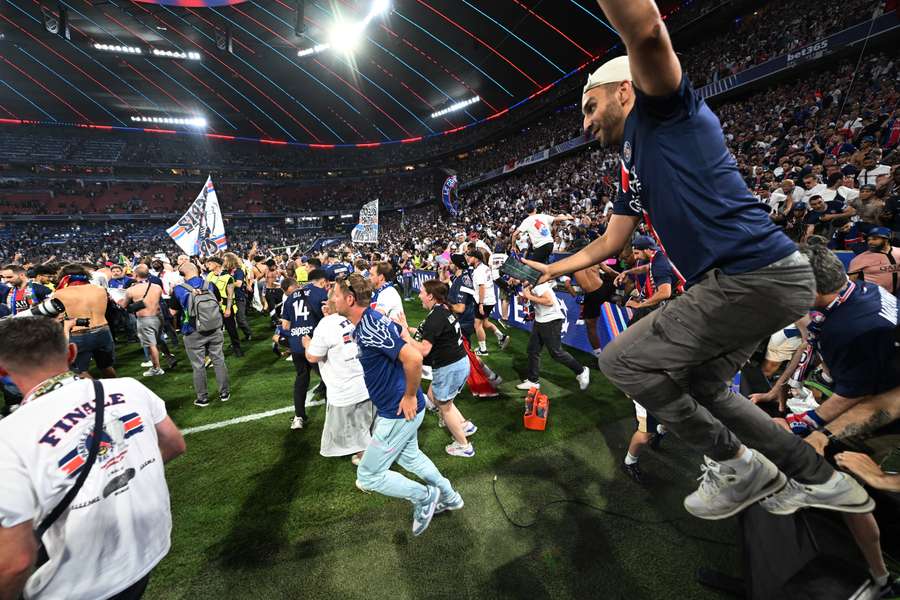 Paris Saint-Germain fans invade the pitch after winning the Champions League