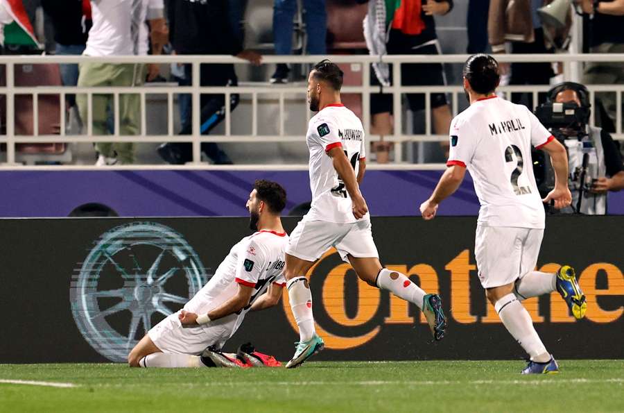 Palestine's Zeid Qunbar celebrates scoring their second goal against Hong Kong