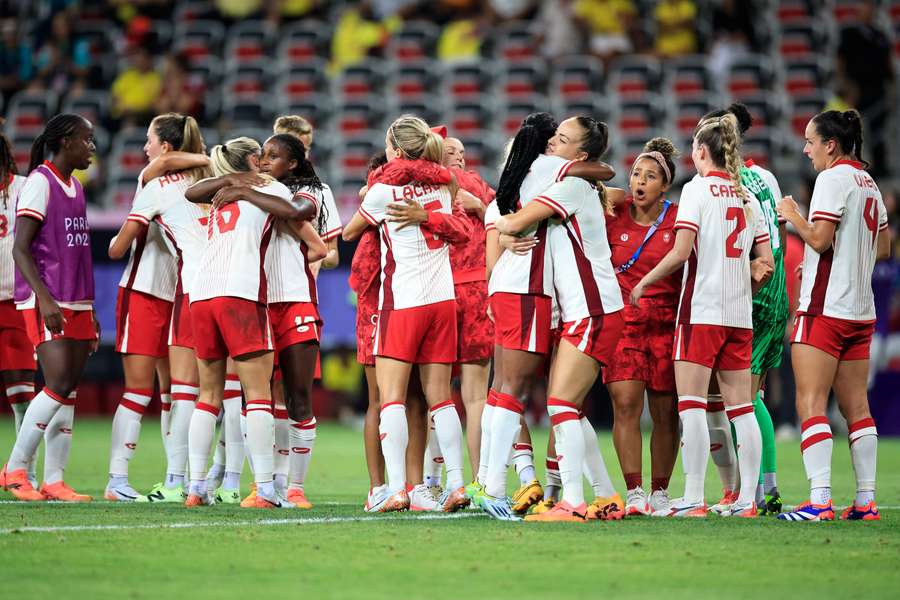 Canada's players celebrate their victory over Colombia 