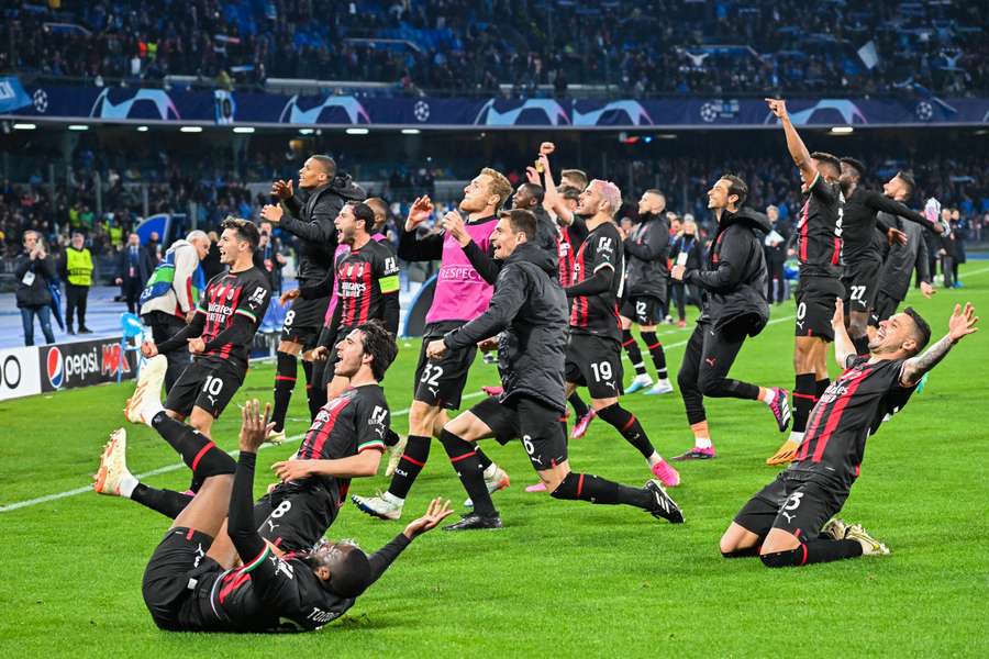 AC Milan celebrate in front of their supporters at full-time