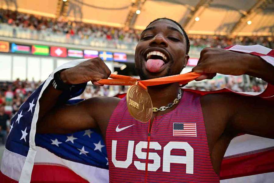 Noah Lyles celebrates with his world championship gold