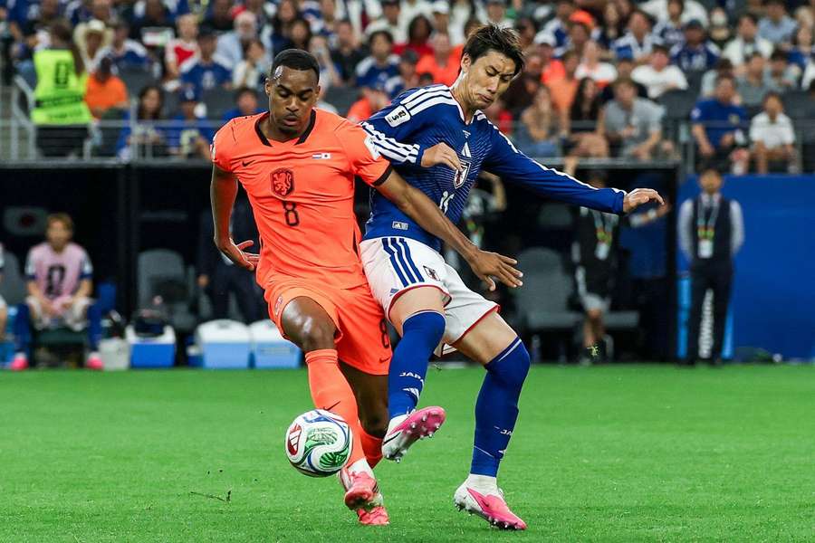 Ryan Gravenberch Netherlands (L) and Daichi Kamada of Japan Ryan Gravenberch Netherlands (L) and Daichi Kamada of Japan
