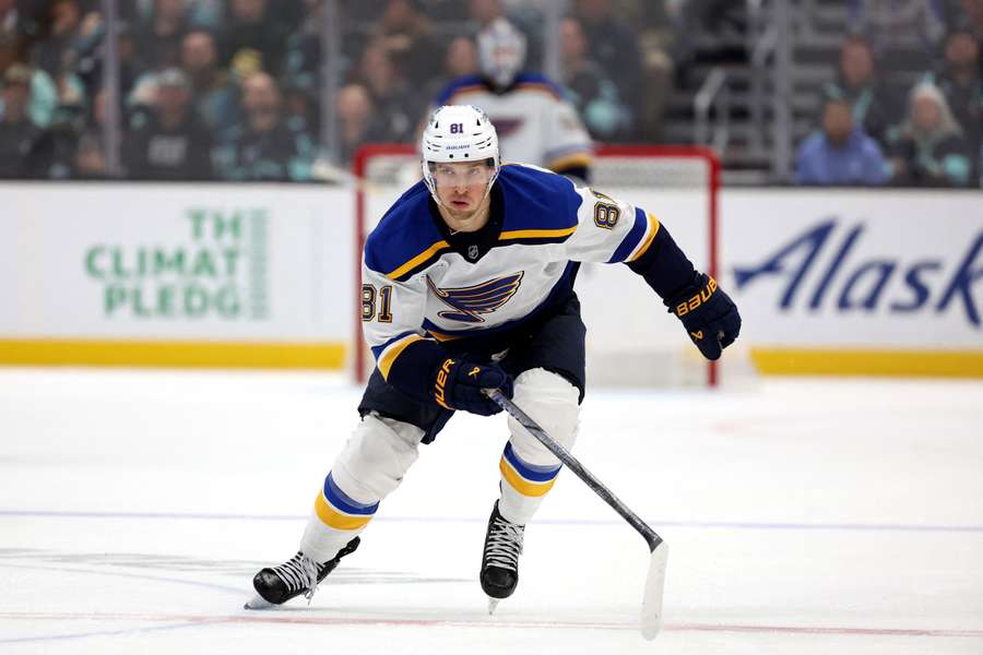 Dylan Holloway skating up the ice in a game against the Seattle Kraken