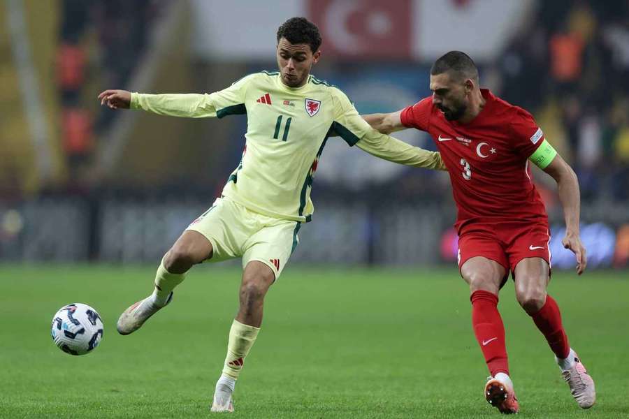 Merih Demiral (R) of Turkey in action against Brennan Johnson (L) of Wales