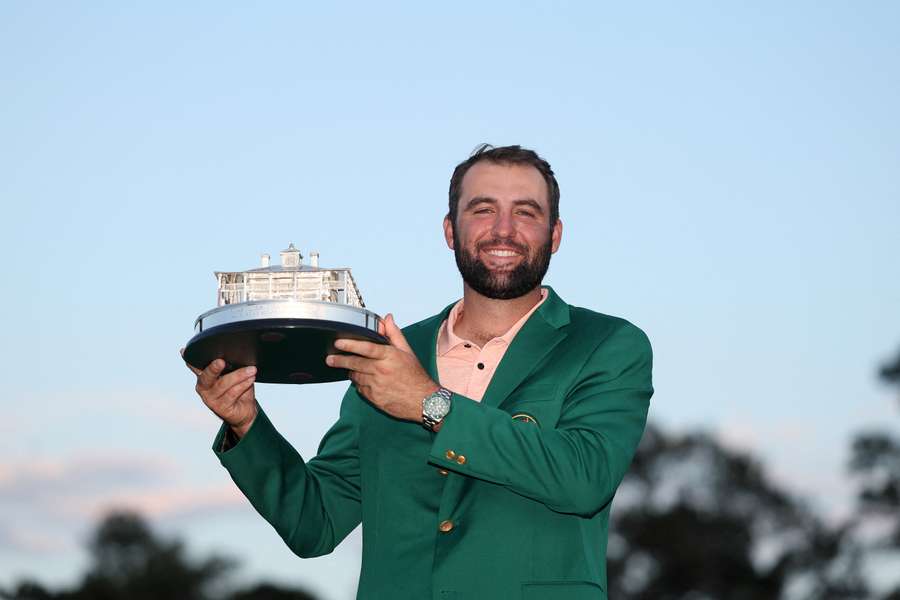 Scheffler celebrates with the Masters trophy