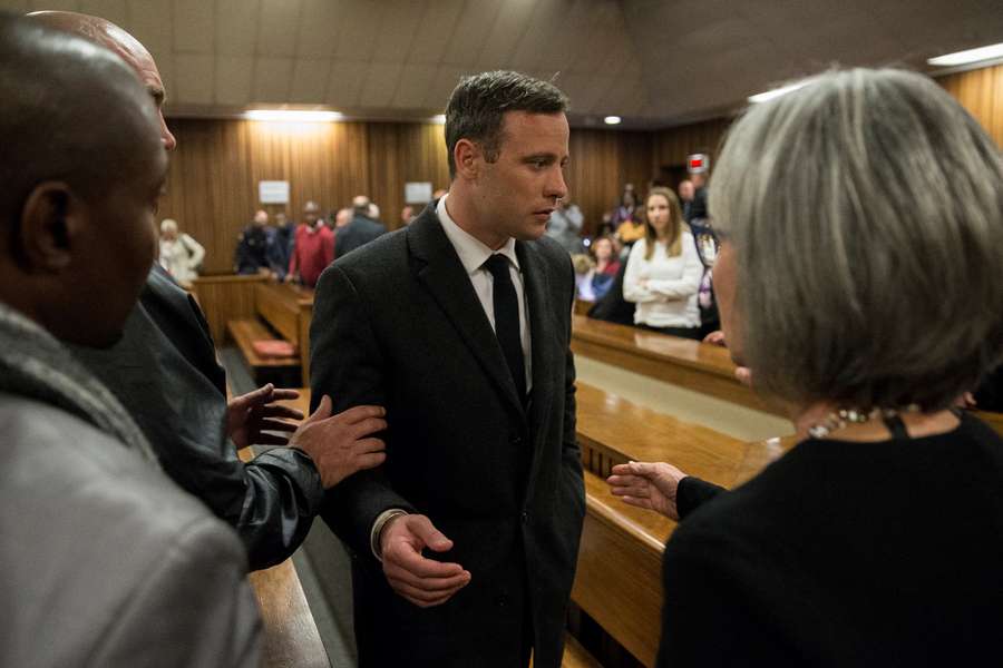 Oscar Pistorius (C) was found guilty of murder and given a 13-year jail sentence in 2017